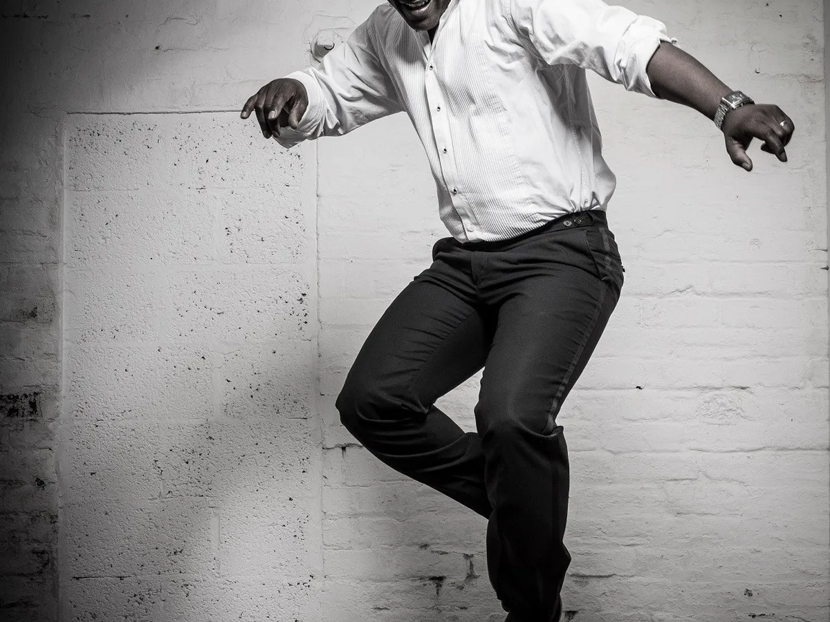 A black-and-white portrait in motion